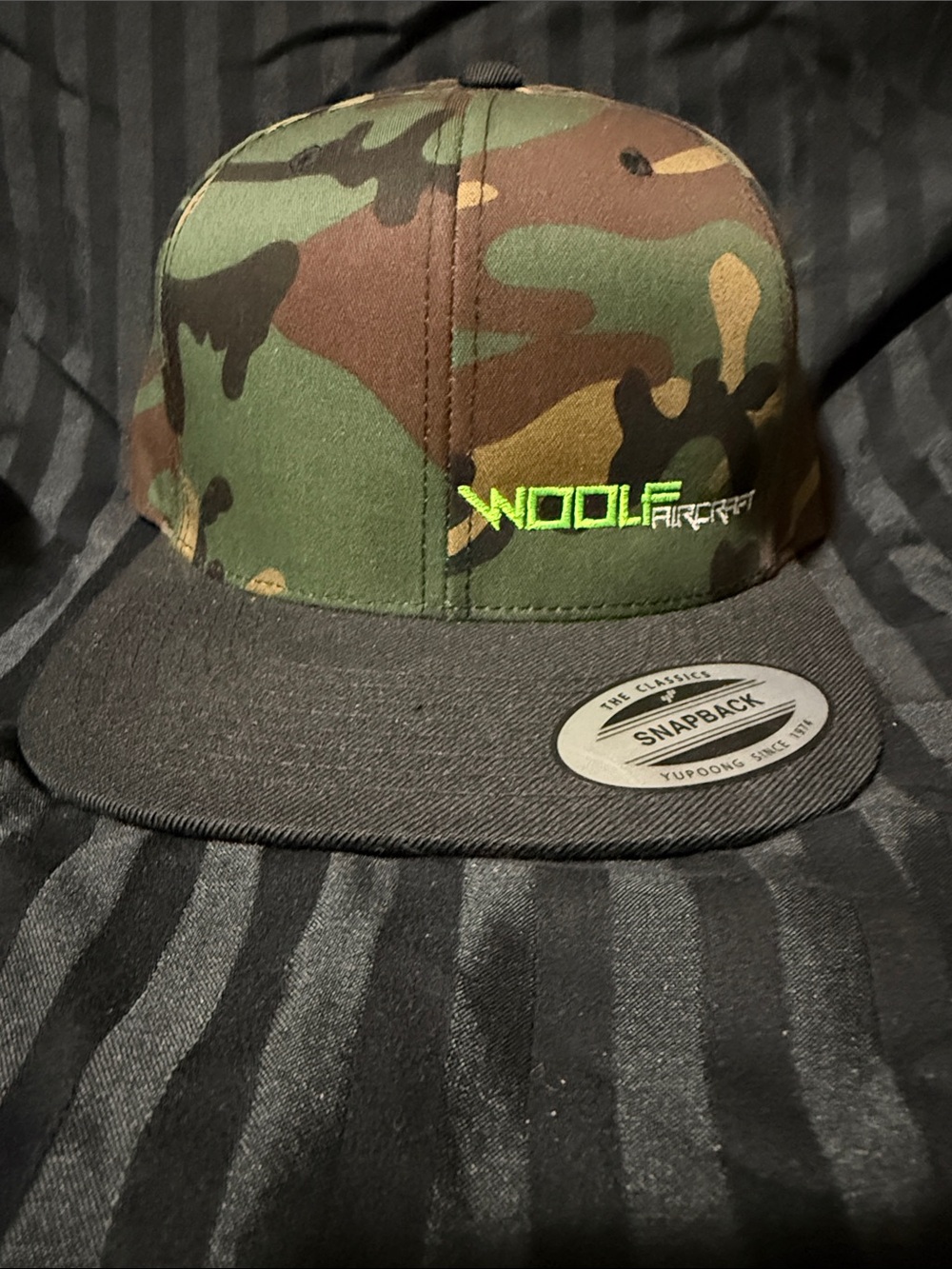 The Classic Camo Snapback Hat with Green Embroidery